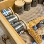 organized rv kitchen drawer with glass jars