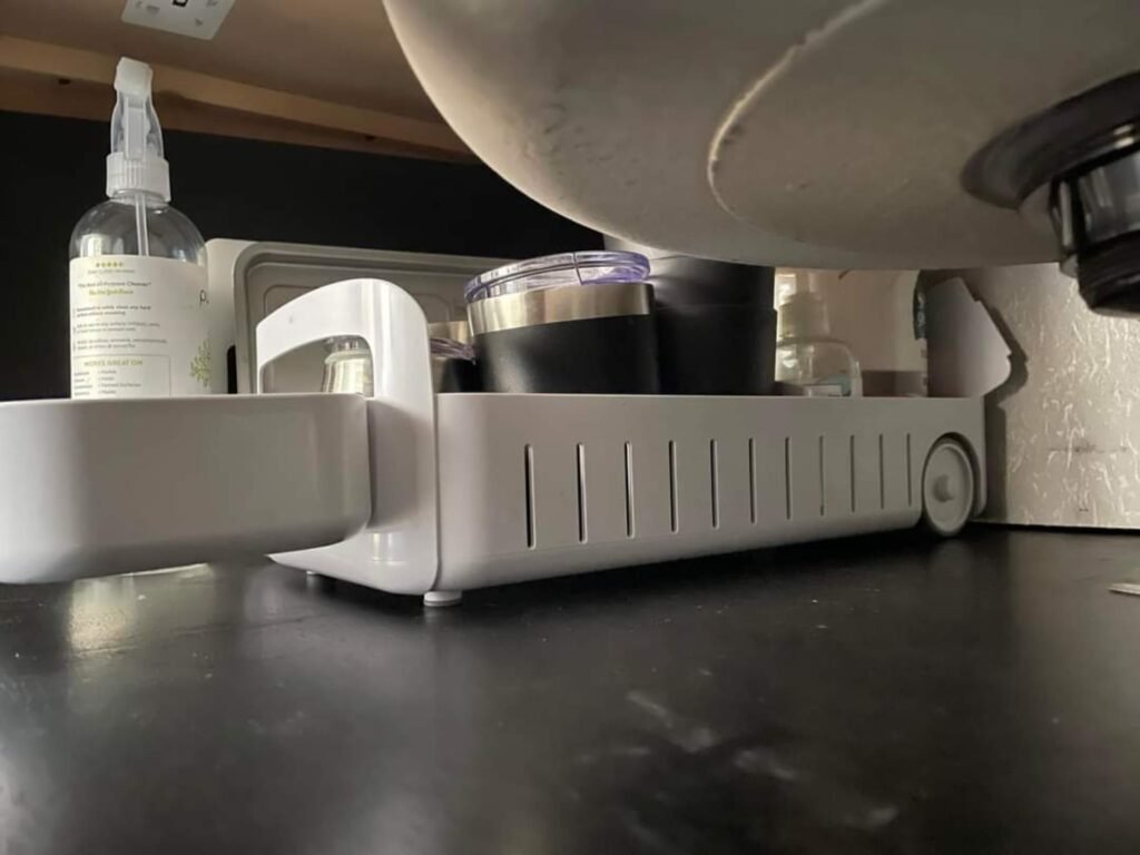 under sink sliding organizer in RV bathroom